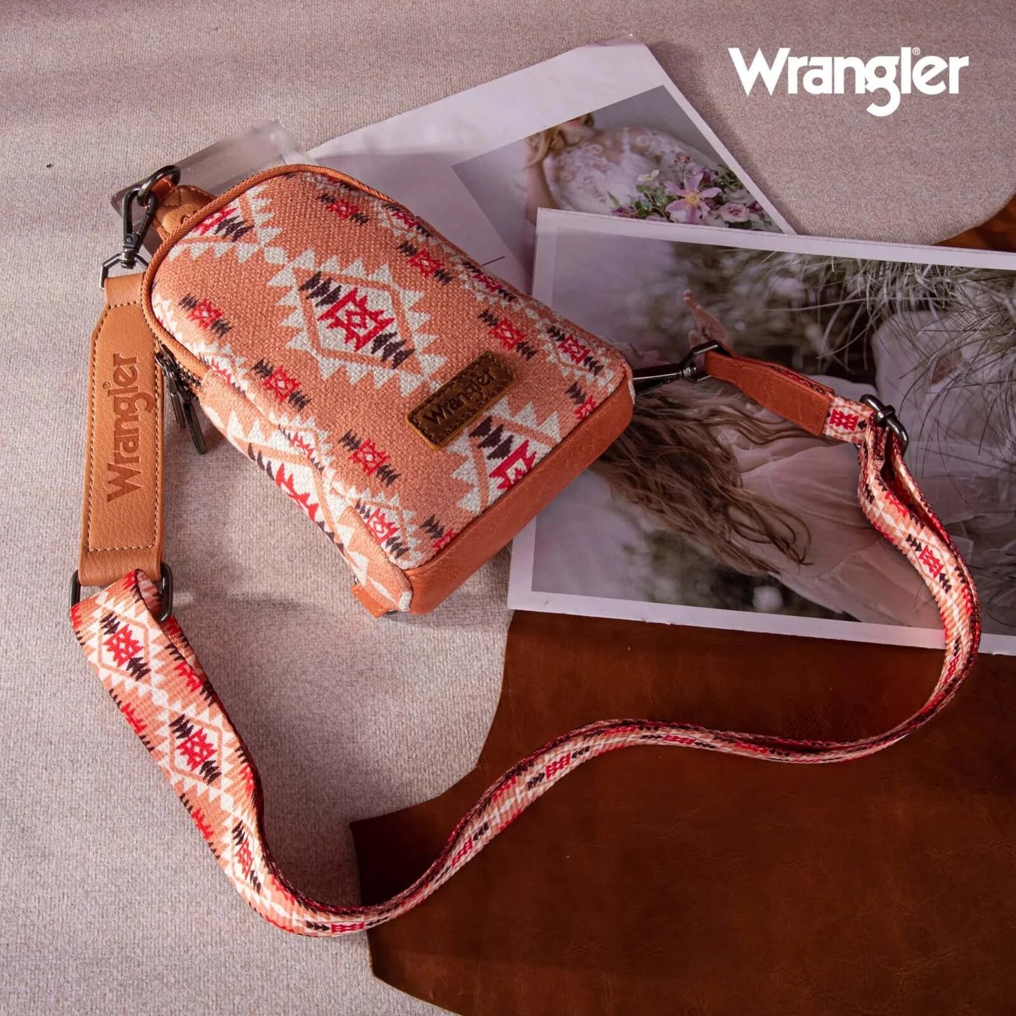 Wrangler-aztec-crossbody-sling-bag-front-on-floor-view-orange